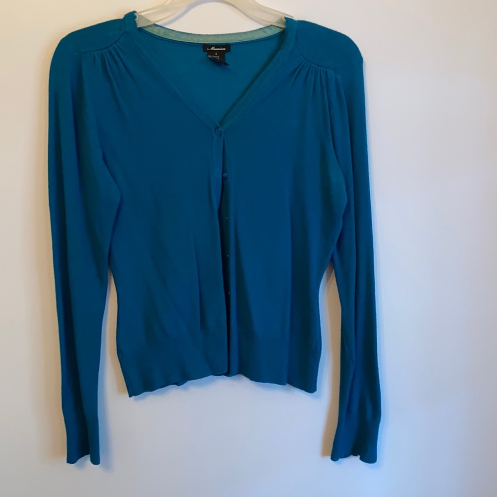 Maurice’s teal cardigan